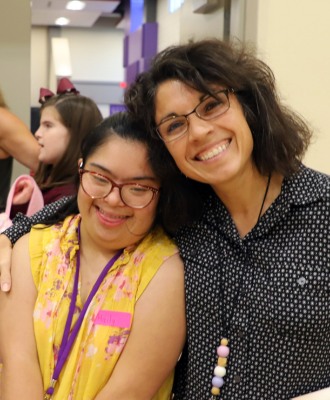  Unite and Thrive Club. Two people posing and smiling.